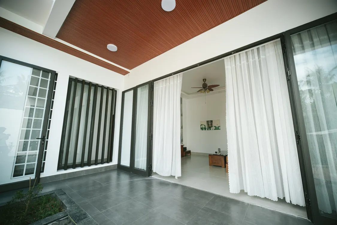 White curtains on sliding glass doors in a living room